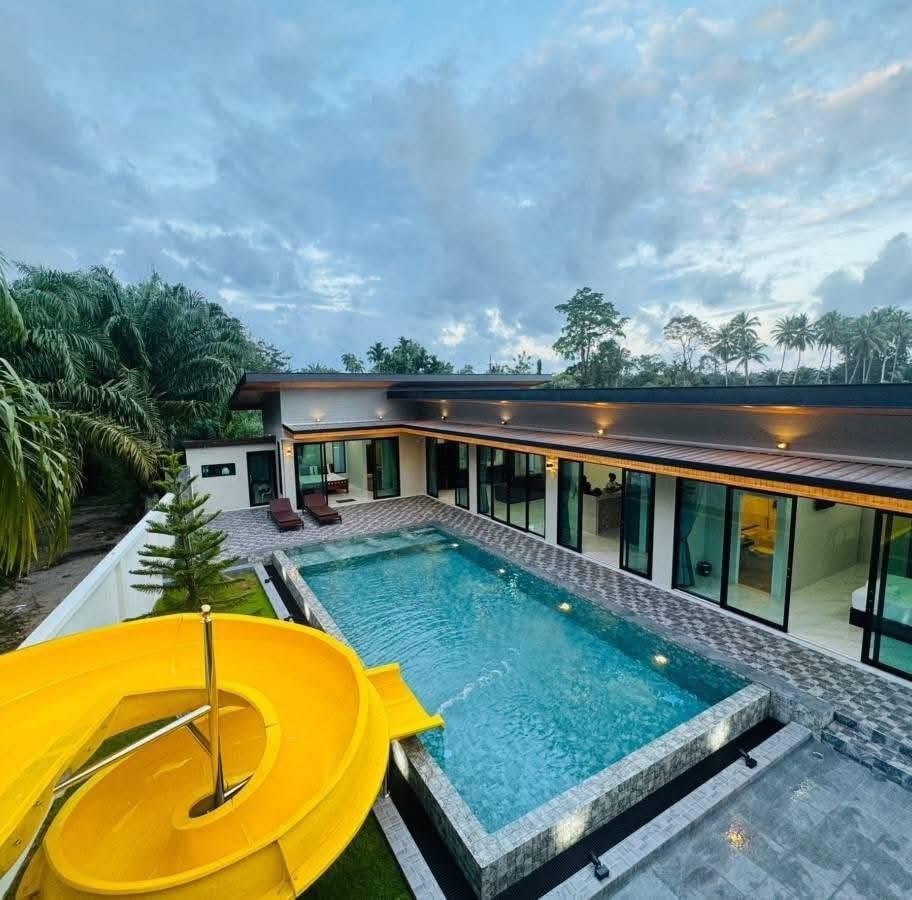Site photograph of Khanom Pool Villa: Pool from the raised terrace