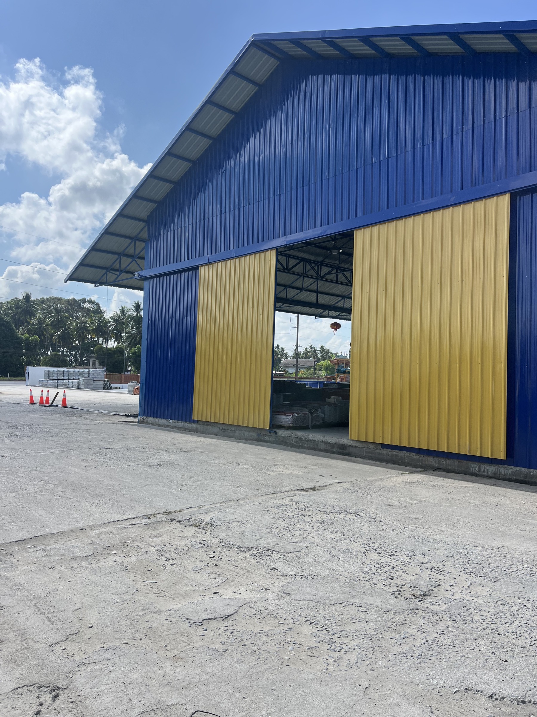Factory Renovation - Tha Phae - Blue facade and yellow sliding doors