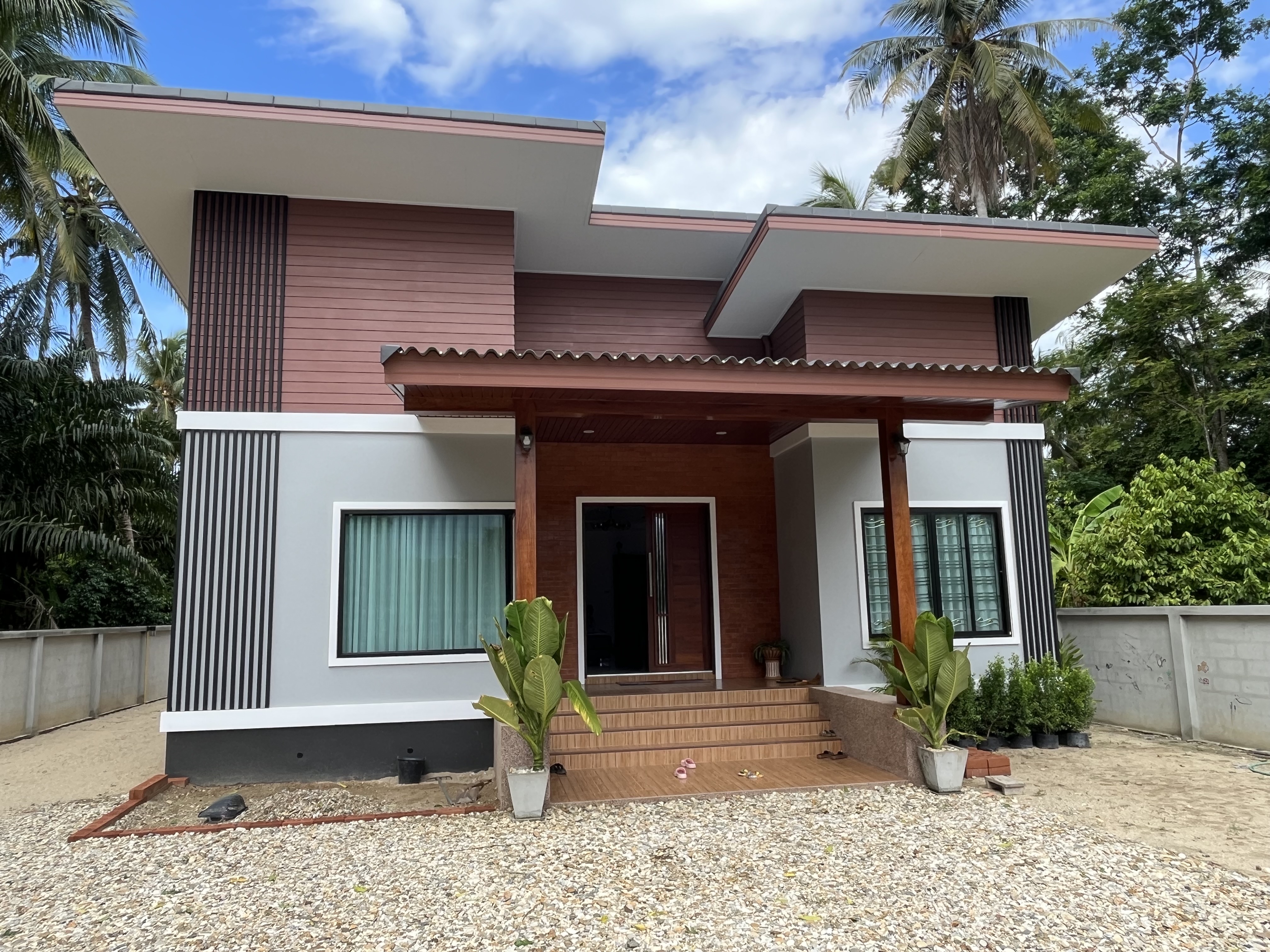 Site photograph of the Thasala house: Front elevation